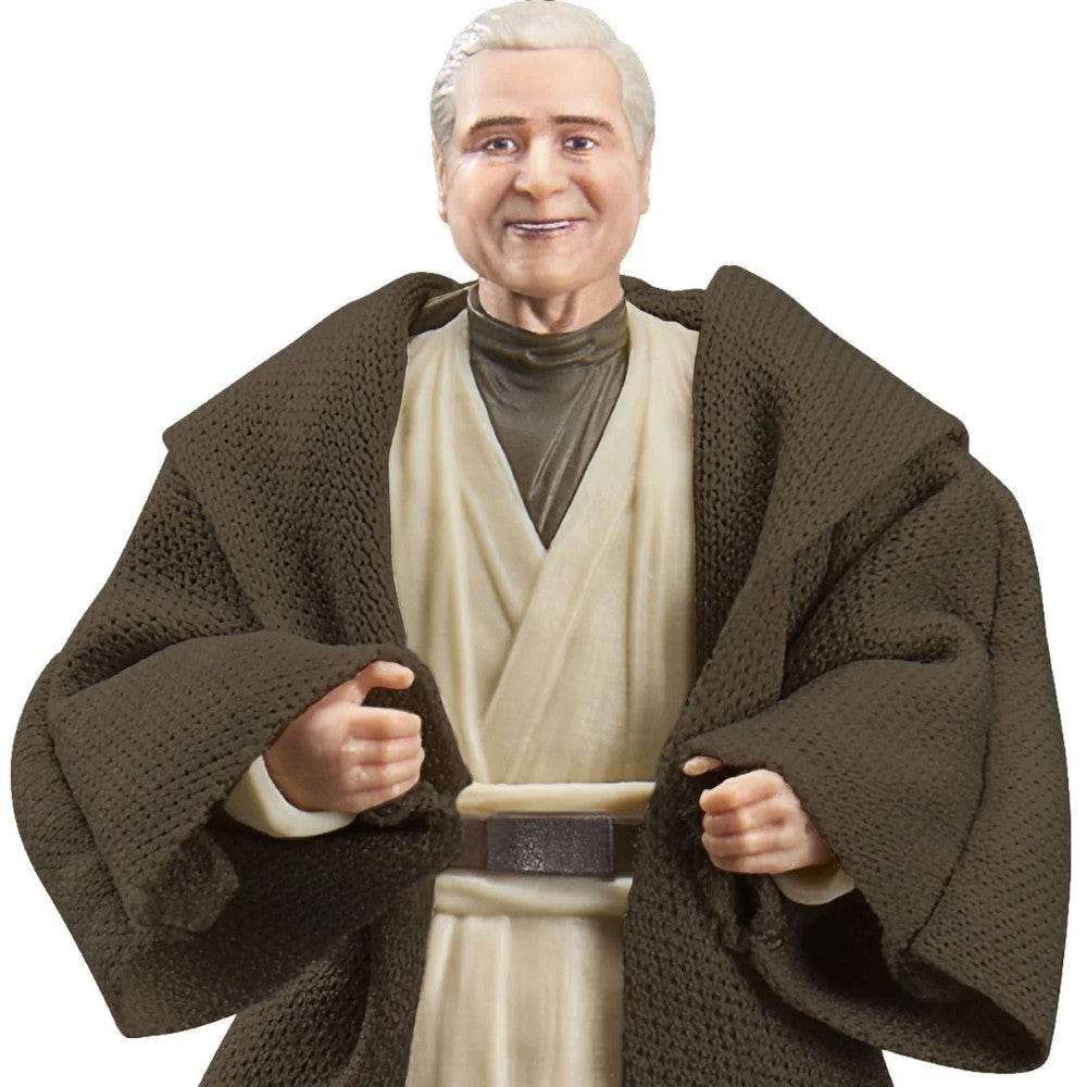 Smiling older action figure wearing a brown robe over a cream tunic