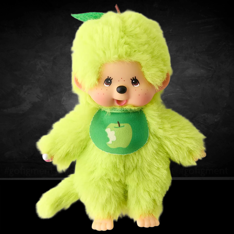 Sekiguchi Monchhichi plush in bright apple green with bib featuring a bitten apple design and soft fur body.