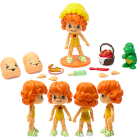 Boss Fight Studio Llc Apple Dumplin articulated figure with curly orange hair, yellow bonnet, striped green shoes, and accessories on white background