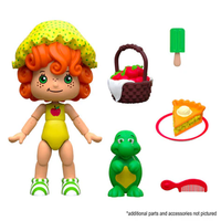 Boss Fight Studio Llc Apple Dumplin figure with curly orange hair, yellow bonnet, green shoes, basket, dinosaur, pie, comb, and popsicle