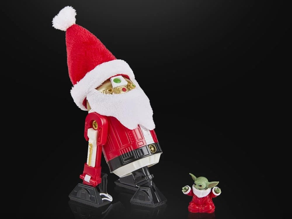 Star Wars Black Series Astromech Droid Holiday Edition figure by Hasbro dressed as Santa next to small festive Baby Yoda figure
