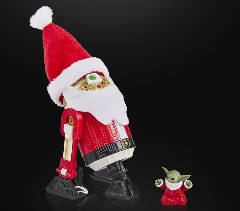 Star Wars Black Series Astromech Droid Holiday Edition figure by Hasbro dressed as Santa next to small festive Baby Yoda figure