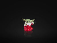 Hasbro Star Wars Black Series Baby Yoda figure in red holiday outfit on black background