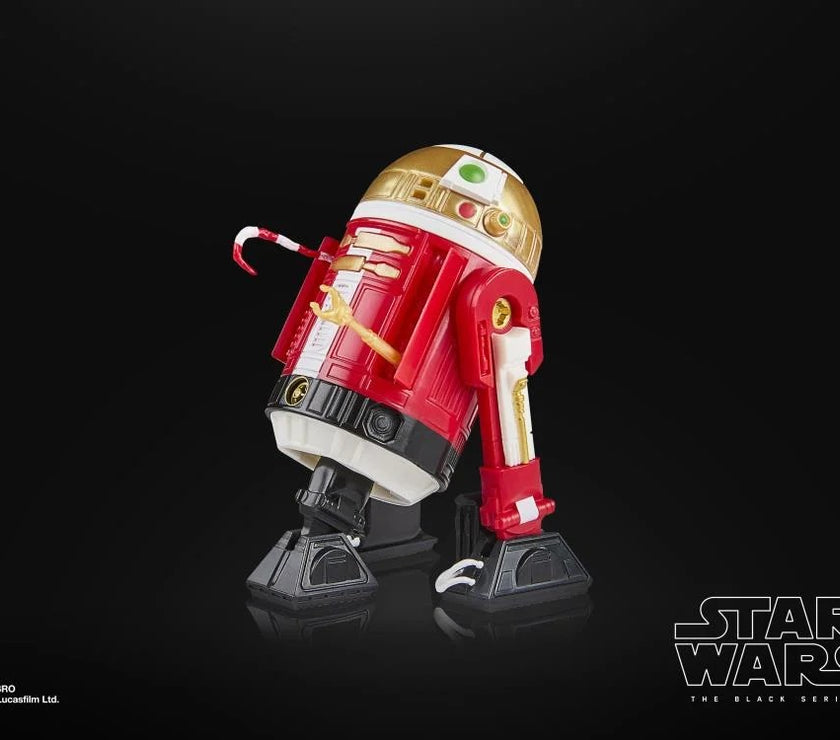 Star Wars The Black Series Holiday Edition astromech droid action figure by Hasbro holding a candy cane on black background