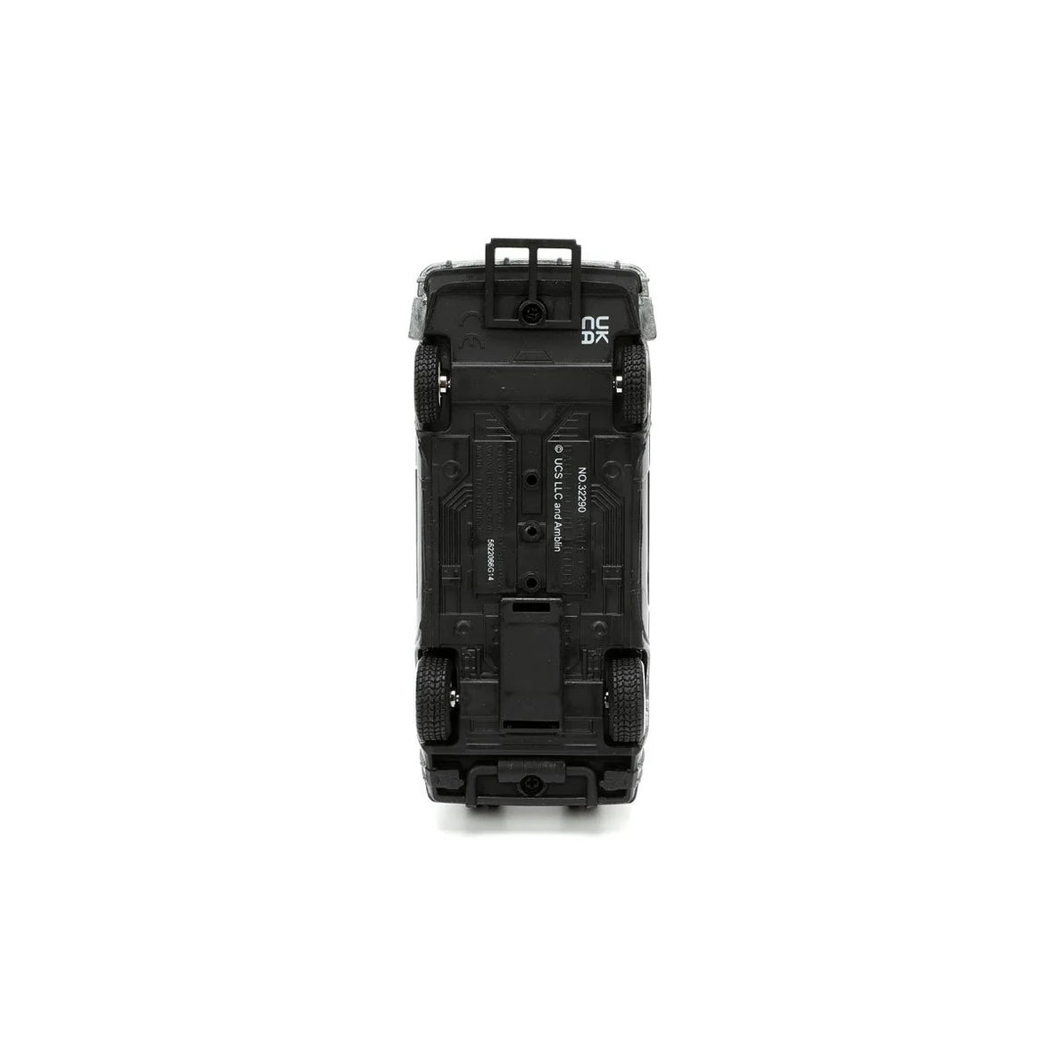 Underside view of a black toy car showing four wheels and molded chassis details