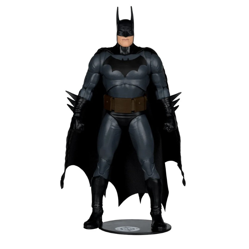 Batman action figure in black and gray suit with cape and bat emblem standing on a display base