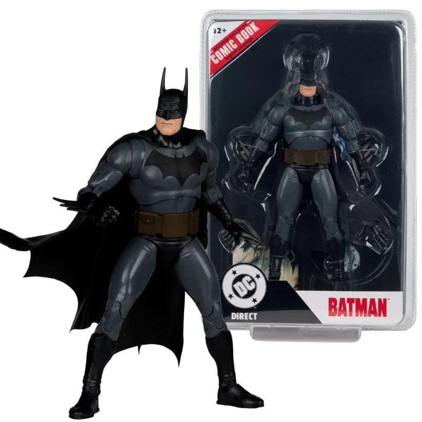 Batman comic book action figure shown next to its retail packaging. The figure is wearing a dark gray and black suit with a brown utility belt and a flowing black cape.