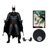 Batman action figure with black cape, two gloves, character card, and a round DC logo display stand.