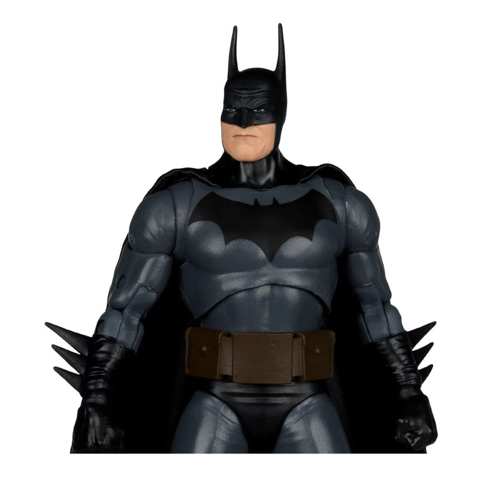 Dark gray and black Batman figure with pointed ears, bat emblem on chest, utility belt, and spiked gauntlets.