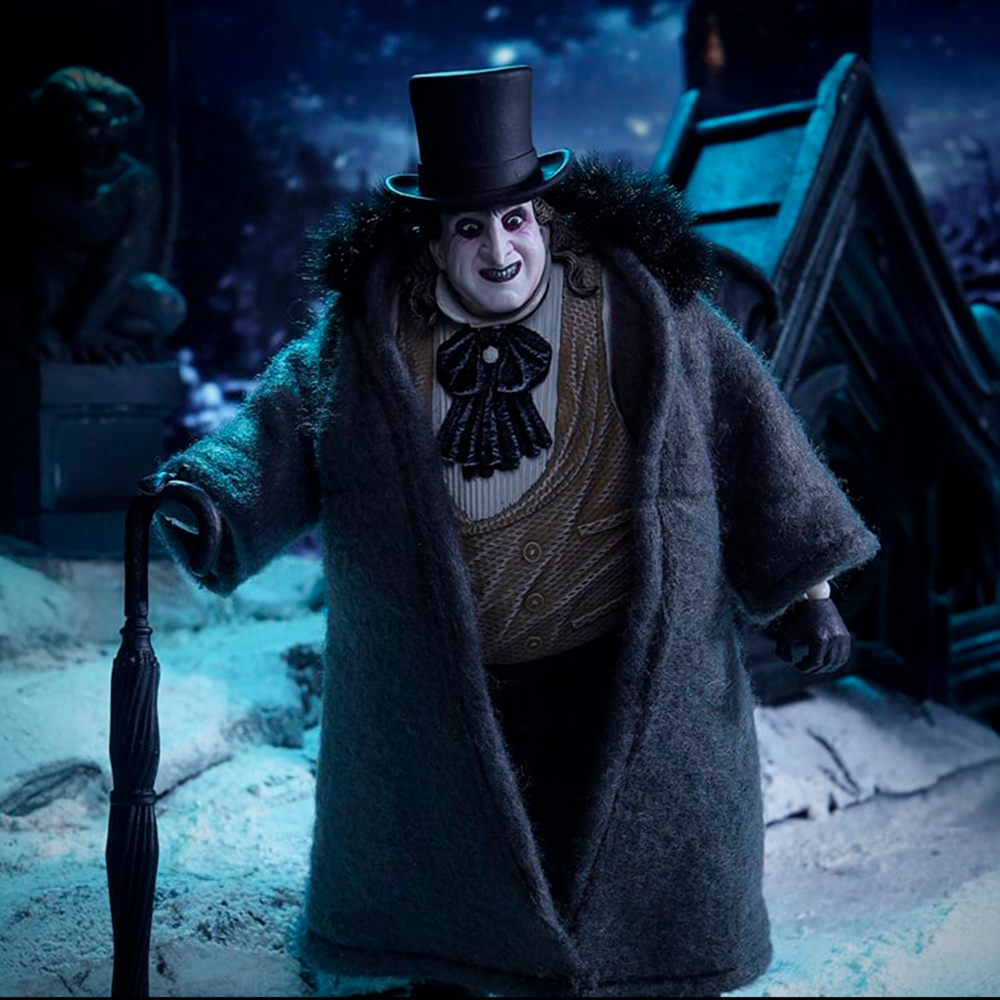 McFarlane Batman Returns The Penguin Deluxe Theatrical Edition action figure in detailed costume with umbrella in dark snowy setting