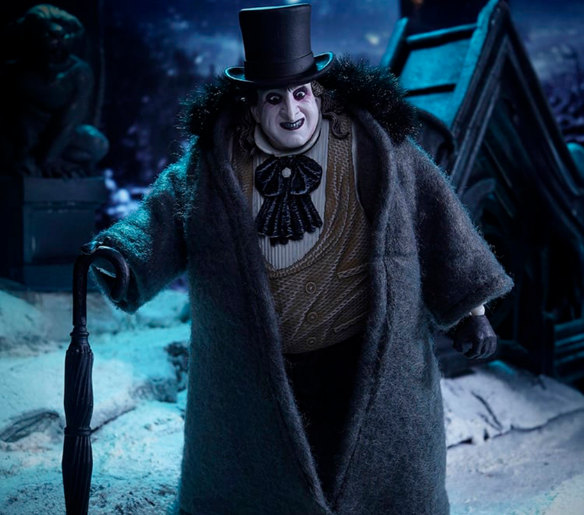 McFarlane Batman Returns The Penguin Deluxe Theatrical Edition action figure in detailed costume with umbrella in dark snowy setting