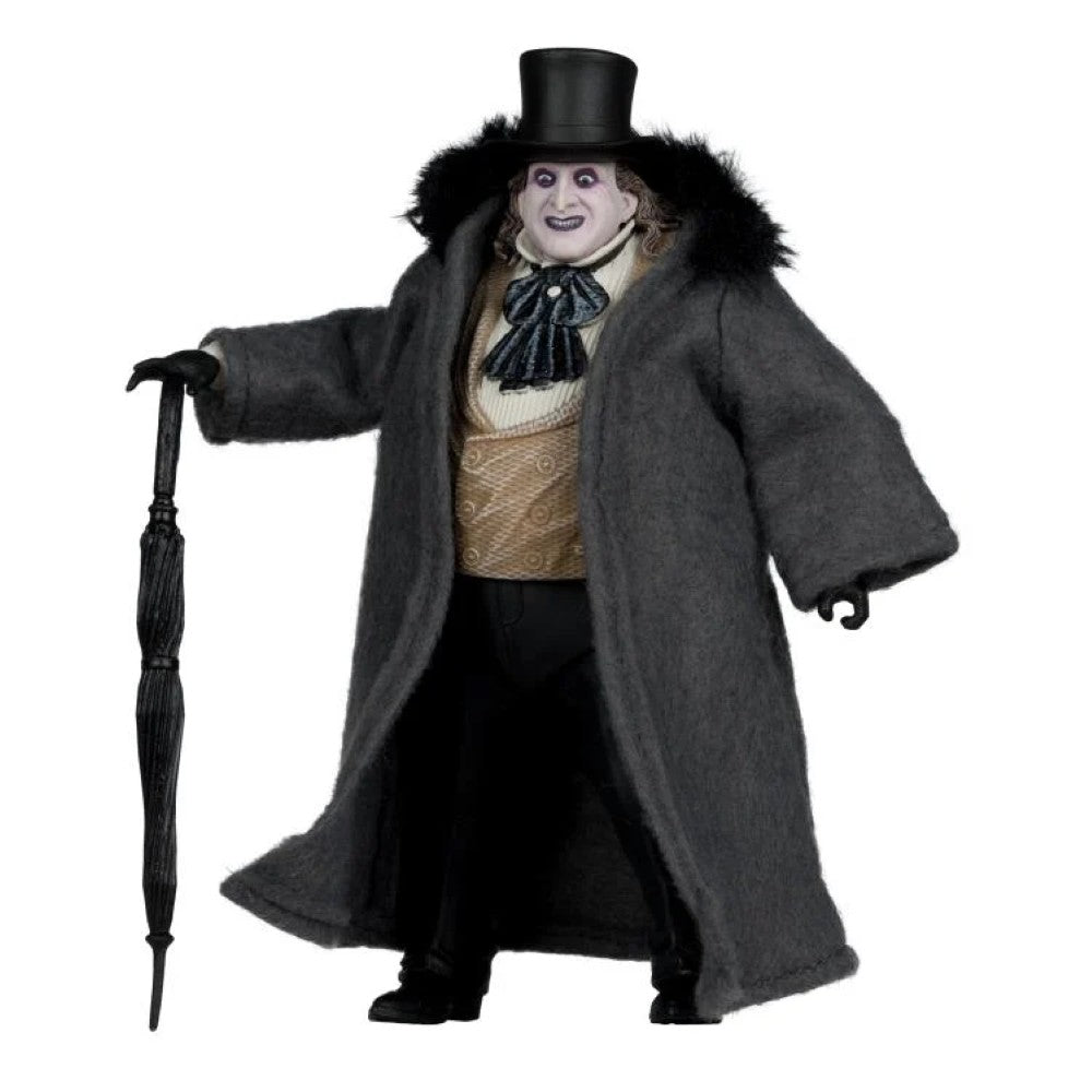 McFarlane Batman Returns Penguin deluxe action figure wearing coat and top hat holding an umbrella