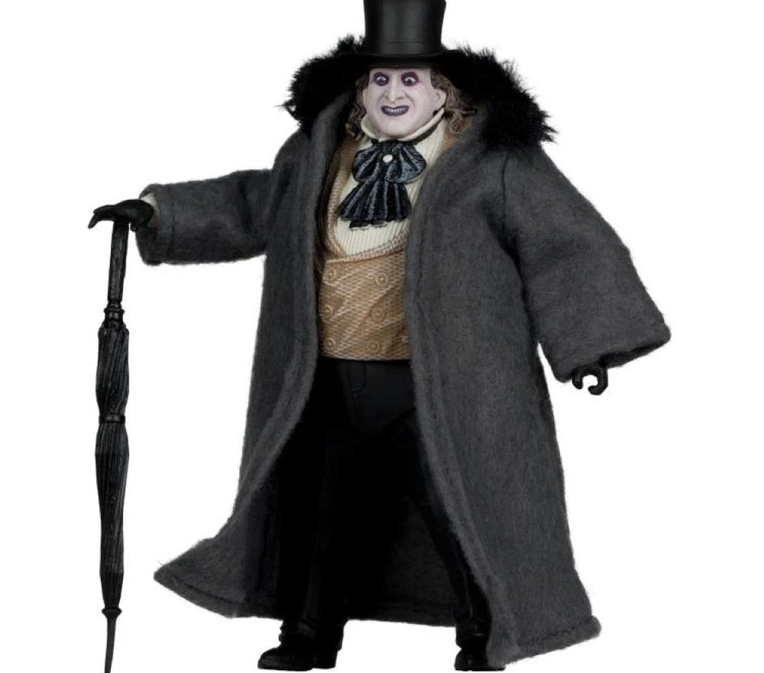 McFarlane Batman Returns Penguin deluxe action figure wearing coat and top hat holding an umbrella