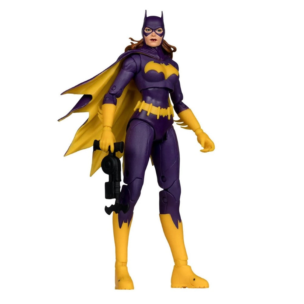 McFarlane 7-inch Batgirl figure in purple and yellow costume holding gadget in dynamic pose on white background