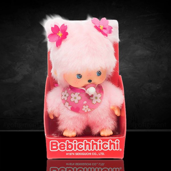 Sekiguchi Monchhichi Bebichhichi plush in cherry blossom pink with floral bib, 4.75 inches tall collectible toy