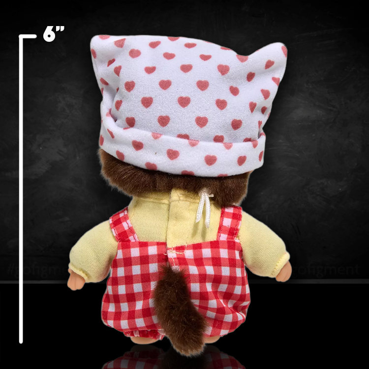Back view of 6-inch Monchhichi Bebichhichi plush in Hello Kitty-inspired red gingham overalls and white hat with pink hearts