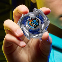 Hand holding a blue and silver spinning top with a colorful center design