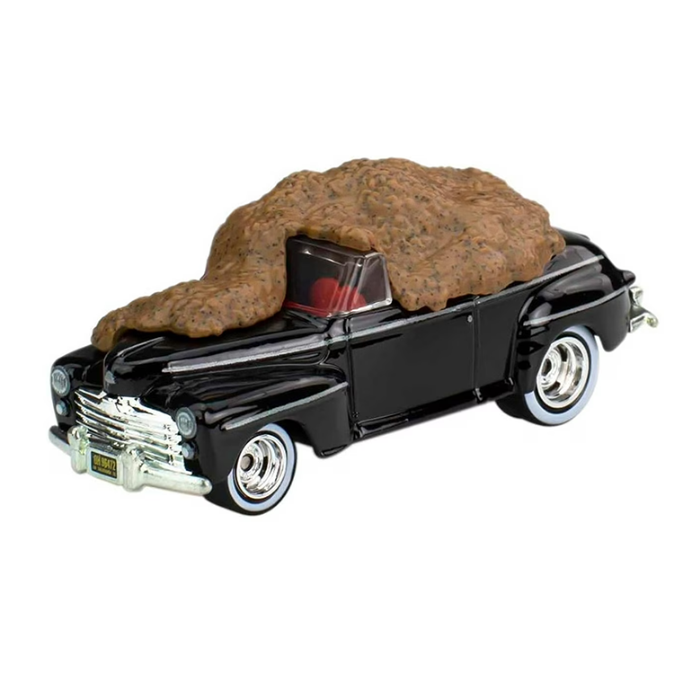 Hot Wheels Mattel Back to the Future Ford Super De Luxe diecast car covered with detailed manure sculpt.
