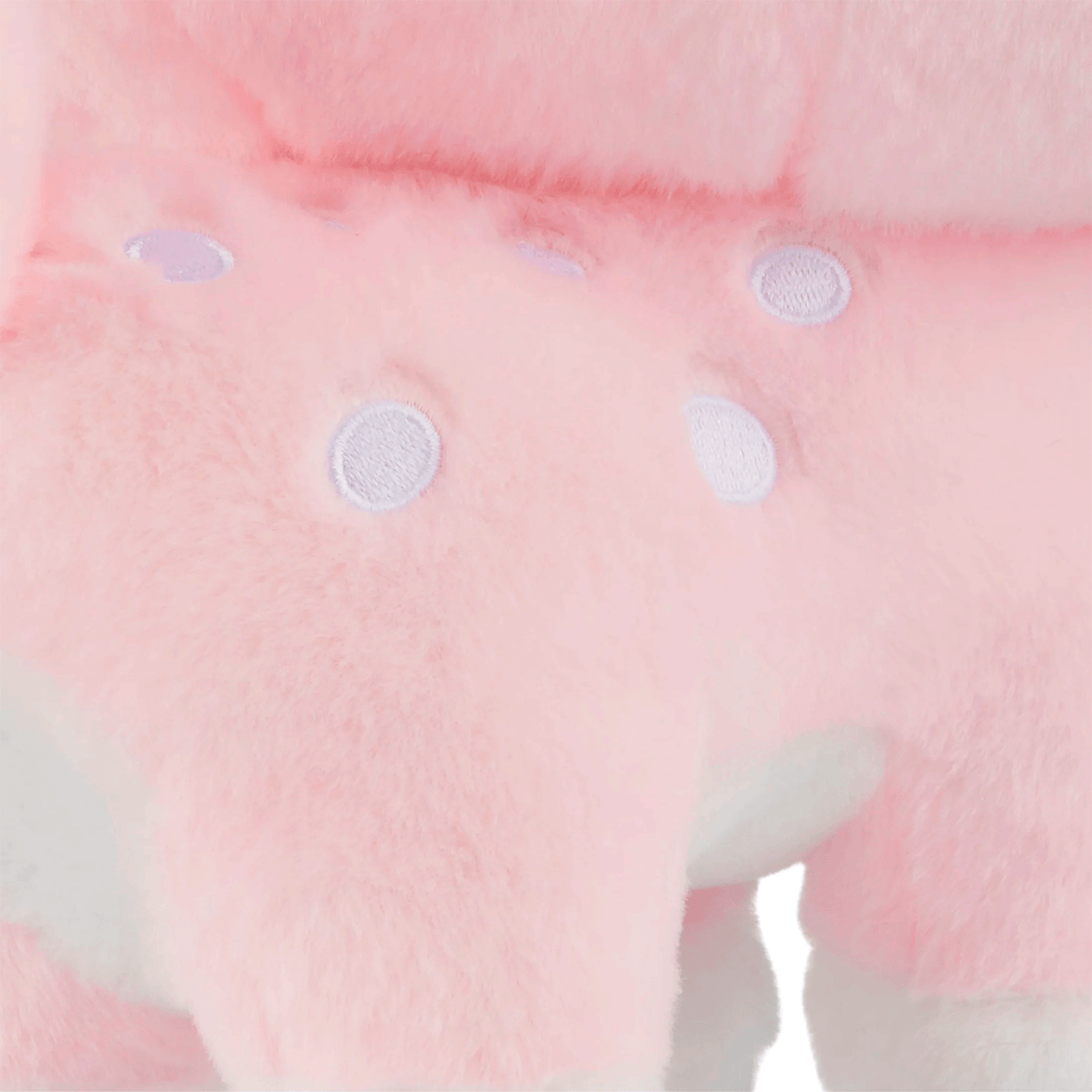 Close-up of Birduyen Speckle the pink deer plush with soft fur and white embroidered spots