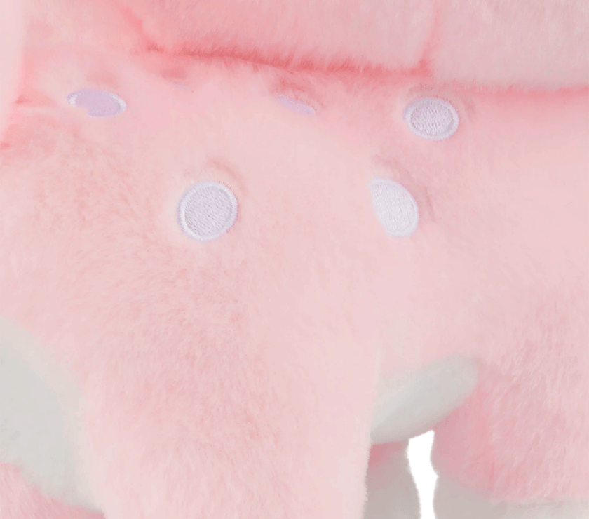 Close-up of Birduyen Speckle the pink deer plush with soft fur and white embroidered spots