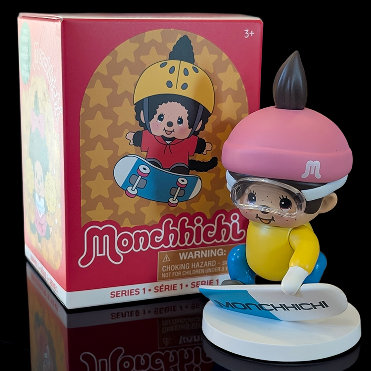 Sekiguchi Monchhichi Boy Snowboarding vinyl figure with pink helmet and goggles on white display stand