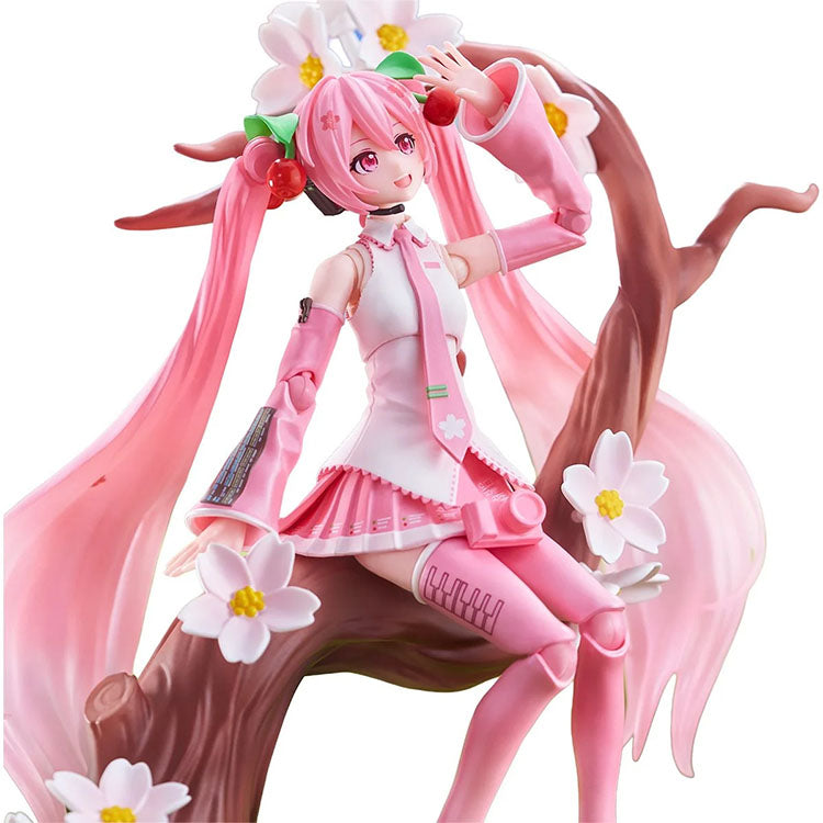 Vocaloid Sakura Miku model kit by Blokees featuring pink outfit and cherry blossom details on a tree branch pose