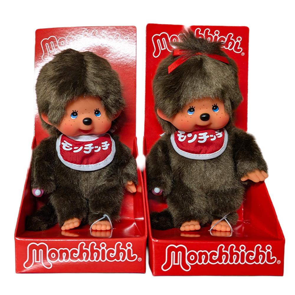 Two Monchhichi dolls in red boxes, one wearing a red headband