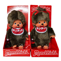 Two Monchhichi dolls in red boxes, one wearing a red headband