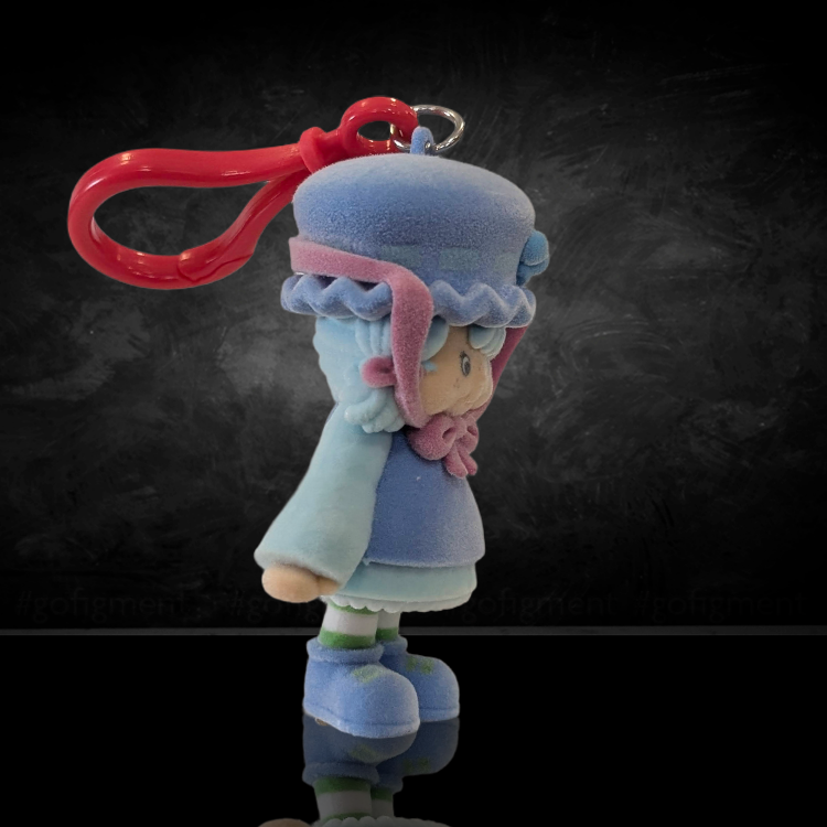 UCC World of Strawberry Shortcake soft flocked mini figure clip wearing blue bonnet and pink ribbon with red plastic hook attachment