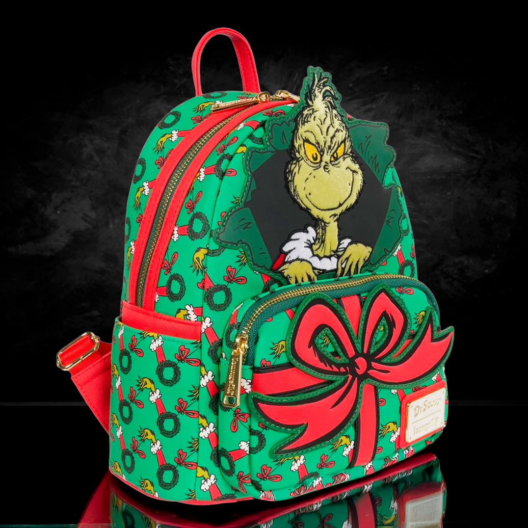 Loungefly How the Grinch Stole Christmas mini-backpack with Grinch and large red bow on green wreath background