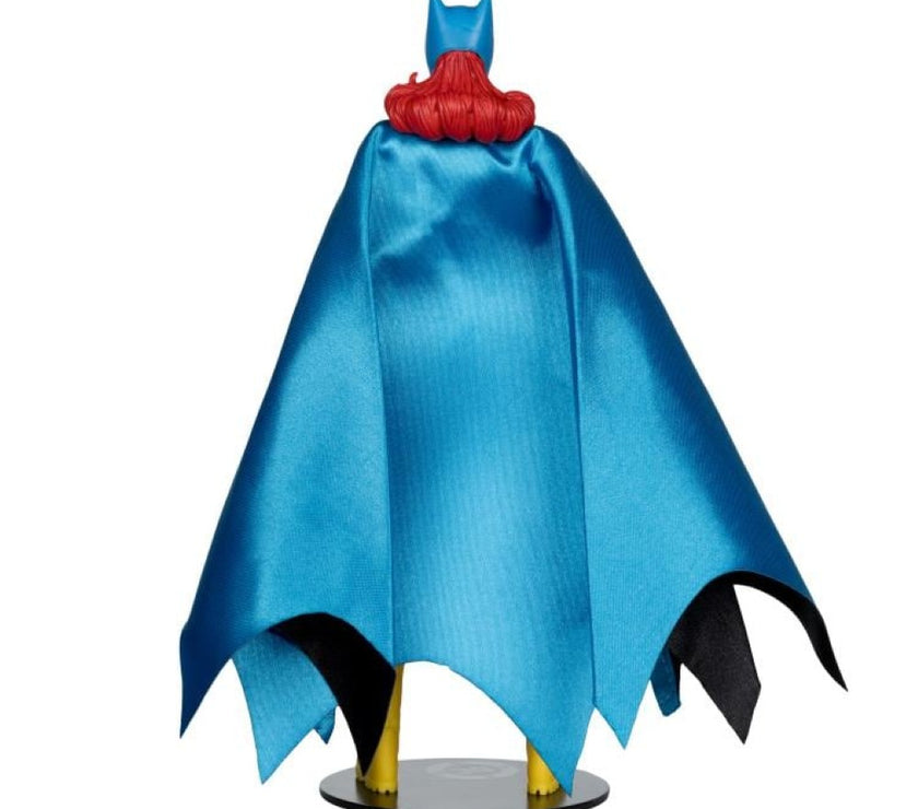 McFarlane DC Classic Batgirl action figure showing blue cape and red hair from the back on a display stand