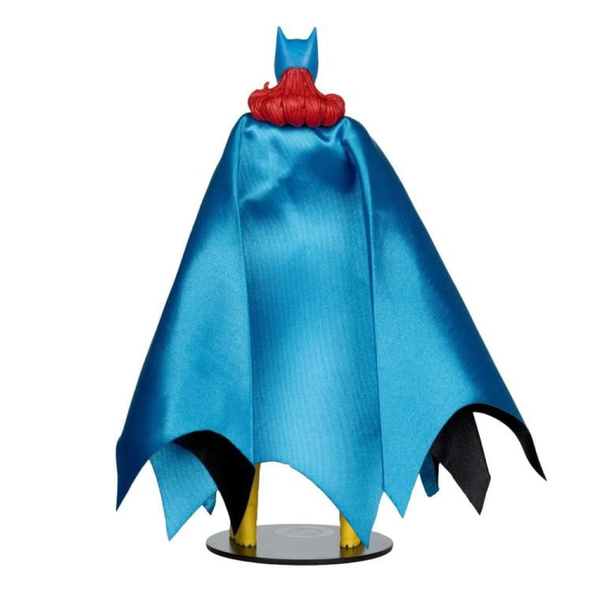 McFarlane DC Classic Batgirl action figure showing blue cape and red hair from the back on a display stand