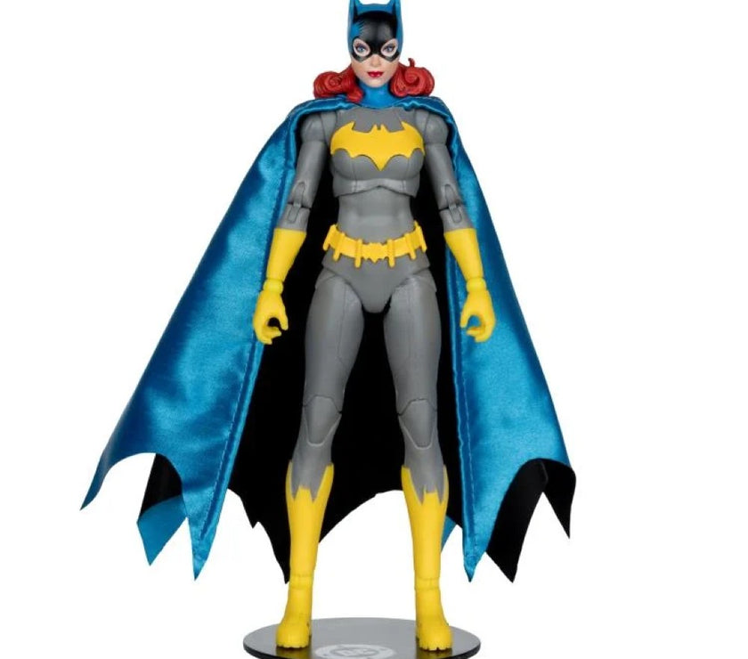 McFarlane DC Multiverse Batgirl action figure in gray suit with blue cape and yellow accents standing on display base