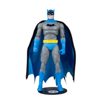 Batman action figure in a gray suit with blue cape, gloves, boots, and yellow utility belt