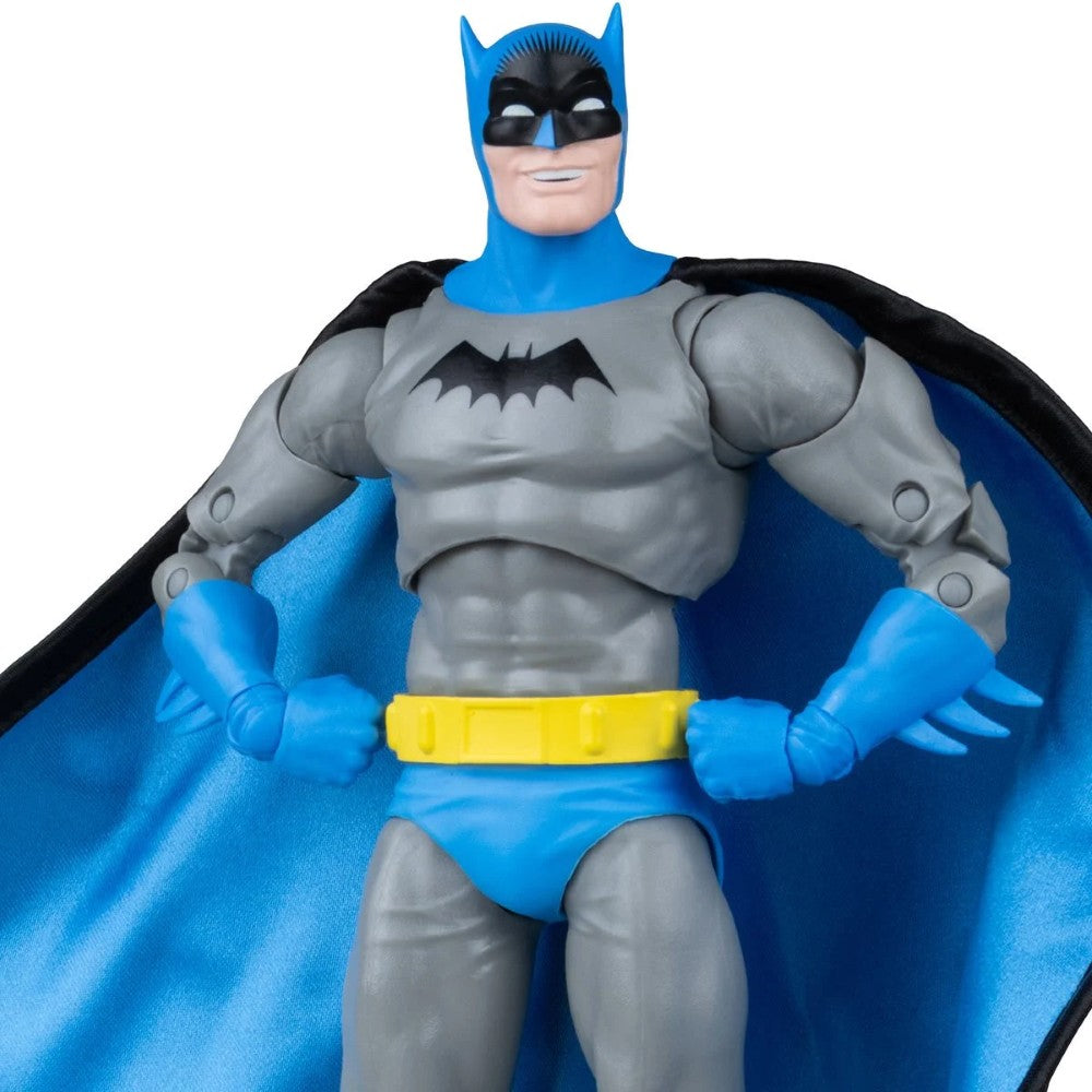 Batman action figure in gray and blue suit with a black cape and yellow utility belt