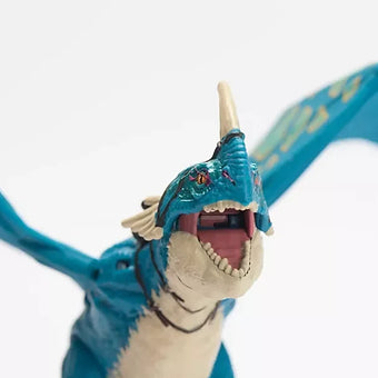 Close-up of Stormfly dragon action figure with open mouth and detailed blue and cream body.