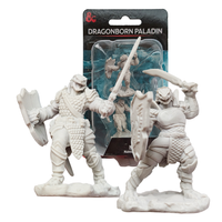 Three unpainted Dragonborn Paladin fantasy figurines with swords and shields one displayed in blister packaging