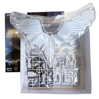 White Evangelion model kit parts and large wing assembly sealed in clear packaging