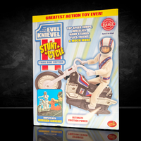 The Original 1970's Evel Knievel Stunt Cycle Upgraded And Advanced NEW by Go Figment featuring a stunt rider on a motorcycle toy packaging.