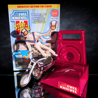 The Original 1970's Evel Knievel Stunt Cycle Upgraded And Advanced NEW displayed with red launcher and original Go Figment packaging.