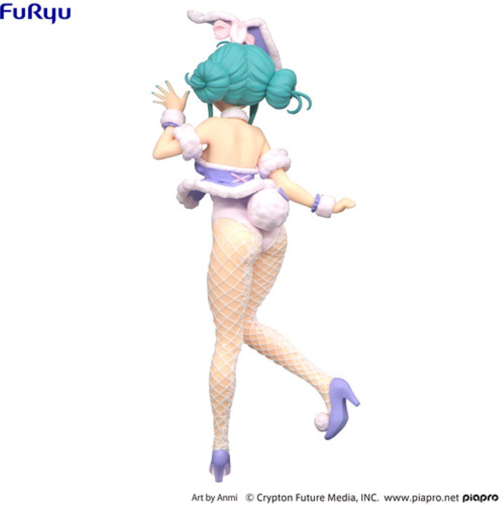 Anime style female figurine with turquoise hair, bunny ears, fishnet stockings, and purple high heels viewed from behind