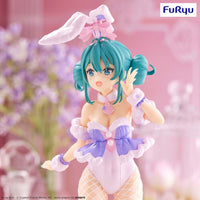 Turquoise haired anime figure wearing a purple and white bunny outfit with fishnet stockings
