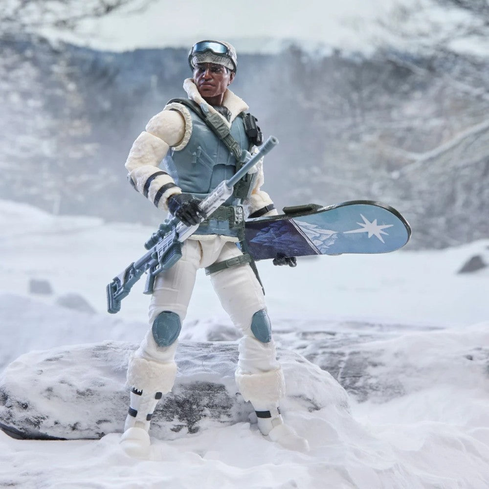 Snow-clad soldier action figure holding a rifle and blue board in a snowy landscape