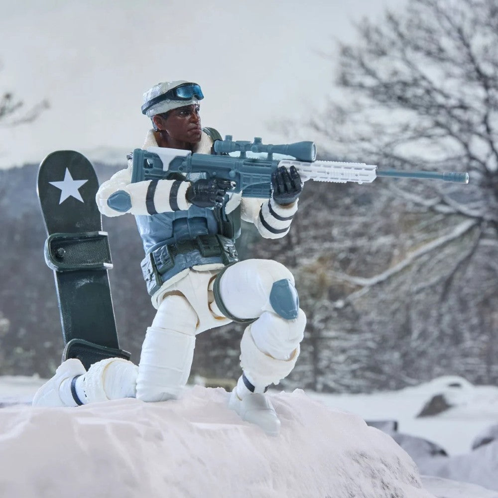 Arctic action figure kneeling in snow with a rifle and snowboard beside a winter forest