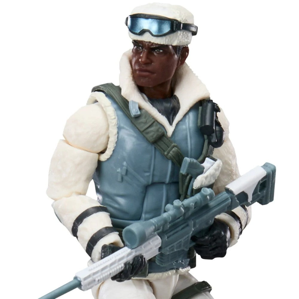 Dark-skinned soldier in white winter gear holding a rifle