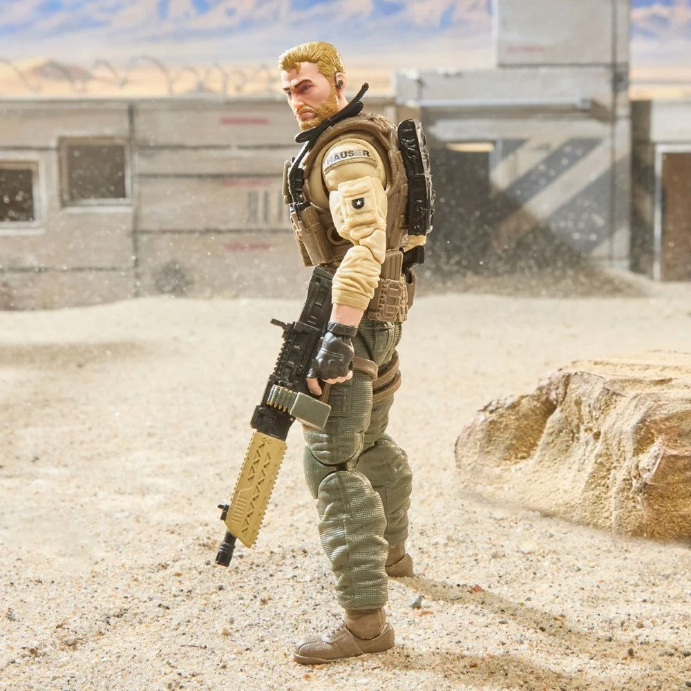 Military action figure holding a rifle in a sandy desert setting