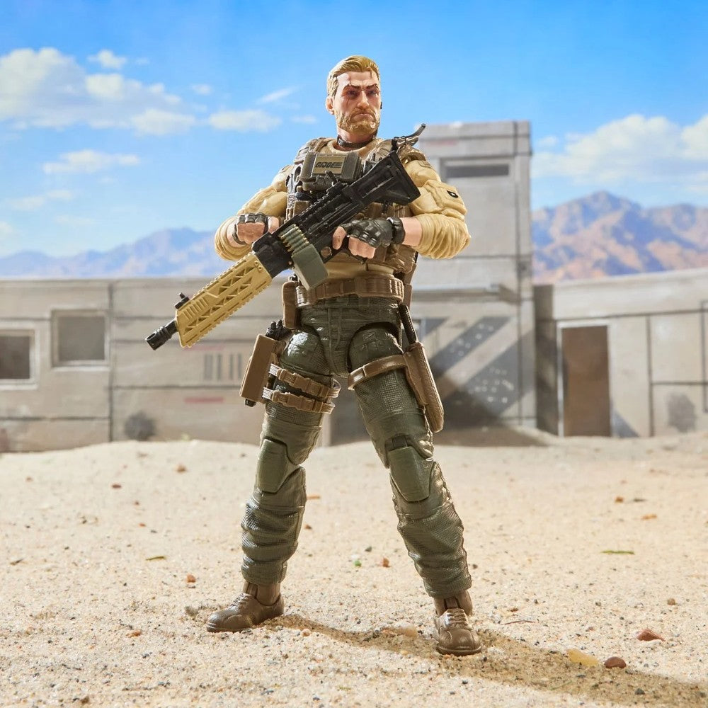 Military action figure holding a rifle in a sunlit desert setting