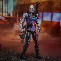 Armored purple-clad action figure holding a rifle in a smoky industrial setting