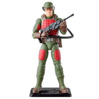 Green and red armored military action figure holding a rifle on a black display stand