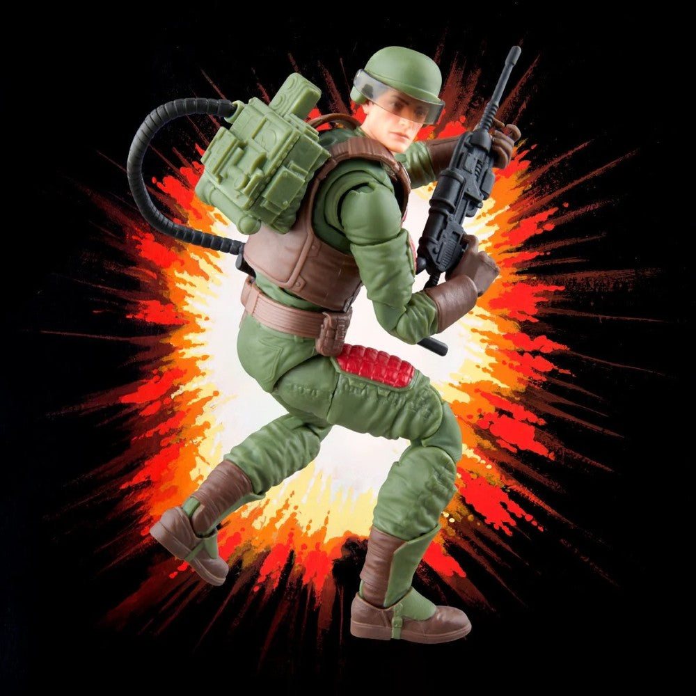 Military action figure in green uniform holding a rifle against a fiery explosion background
